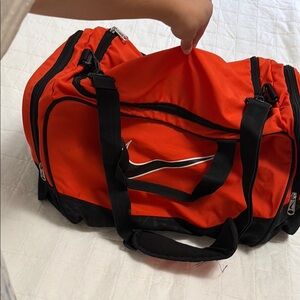 Nike Red and Black Duffel Bag with Durable Design